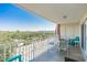 Spacious balcony with outdoor seating and scenic views at 19610 Gulf Blvd # 409, Indian Shores, FL 33785