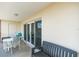 Private balcony with table and chairs, perfect for relaxing at 19610 Gulf Blvd # 409, Indian Shores, FL 33785