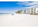 Beachfront property with blue chairs at 19610 Gulf Blvd # 409, Indian Shores, FL 33785