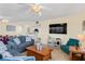 Living room features comfortable seating, a large TV and open concept kitchen view at 19610 Gulf Blvd # 409, Indian Shores, FL 33785