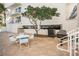 Patio table and chairs with grill at 19610 Gulf Blvd # 409, Indian Shores, FL 33785