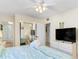 Bedroom with king-size bed and a large flat-screen TV at 19610 Gulf Blvd # 409, Indian Shores, FL 33785