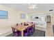 Dining area features a rustic wooden table with purple chairs at 19610 Gulf Blvd # 409, Indian Shores, FL 33785