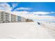 Beachfront property with white building and ocean view at 19610 Gulf Blvd # 409, Indian Shores, FL 33785
