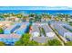 An aerial view of a waterfront community showcases the beautiful homes and access to the ocean at 1109 Pinellas Bayway S # 306, Tierra Verde, FL 33715