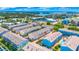 Community aerial view with swimming pool, nearby shopping, and access to waterways at 1109 Pinellas Bayway S # 306, Tierra Verde, FL 33715