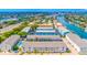 Waterfront condo community boasts lush landscaping, boat docks, and a sparkling pool at 1109 Pinellas Bayway S # 306, Tierra Verde, FL 33715