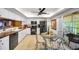Efficient kitchen with a bright dining area, modern appliances, and natural light from a sliding door at 1109 Pinellas Bayway S # 306, Tierra Verde, FL 33715