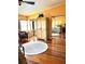 A roomy bedroom with hardwood floors, mirrored closet doors, and an abundance of natural light at 1109 Pinellas Bayway S # 306, Tierra Verde, FL 33715
