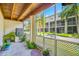 Enclosed patio with lush foliage, concrete flooring and views of the surrounding property at 1109 Pinellas Bayway S # 306, Tierra Verde, FL 33715
