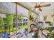 Inviting patio with cozy seating arrangements, a decorative railing, and views of the well-maintained grounds at 1109 Pinellas Bayway S # 306, Tierra Verde, FL 33715
