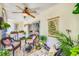 Picturesque patio with comfortable lounge seating, potted plants, and sun protection, perfect for relaxing at 1109 Pinellas Bayway S # 306, Tierra Verde, FL 33715
