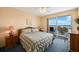 Main bedroom with water view and comfortable bed at 8001 Sailboat Key S Blvd # 204, St Pete Beach, FL 33707