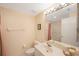 Small bathroom with single sink and bathtub at 8001 Sailboat Key S Blvd # 204, St Pete Beach, FL 33707