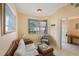 Comfortable living room with wicker furniture and bay window at 8001 Sailboat Key S Blvd # 204, St Pete Beach, FL 33707