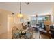Living room with water views, comfy seating, and tiled floors at 8001 Sailboat Key S Blvd # 204, St Pete Beach, FL 33707
