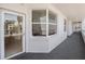 Condo hallway with carpet and exterior access at 8001 Sailboat Key S Blvd # 204, St Pete Beach, FL 33707