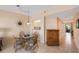 Cozy dining area with glass table and wicker chairs at 8001 Sailboat Key S Blvd # 204, St Pete Beach, FL 33707