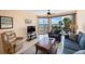 Relaxing living room with water views and comfy seating at 8001 Sailboat Key S Blvd # 204, St Pete Beach, FL 33707