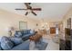 Open living room with water views and ceiling fan at 8001 Sailboat Key S Blvd # 204, St Pete Beach, FL 33707