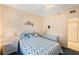 Guest bedroom with comfortable bed and nightstand at 8001 Sailboat Key S Blvd # 204, St Pete Beach, FL 33707