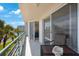 Spacious balcony overlooks water with seating area at 8001 Sailboat Key S Blvd # 204, St Pete Beach, FL 33707