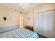 Guest bedroom with built-in dresser and closet at 8001 Sailboat Key S Blvd # 204, St Pete Beach, FL 33707