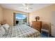 Spacious bedroom with water view and large dresser at 8001 Sailboat Key S Blvd # 204, St Pete Beach, FL 33707