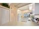 Bright kitchen with white cabinets and view at 8001 Sailboat Key S Blvd # 204, St Pete Beach, FL 33707
