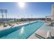 Luxury rooftop pool with lounge chairs at 301 1St S St # 2905, St Petersburg, FL 33701