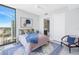 Bright bedroom with city view, comfortable bed and sitting area at 301 1St S St # 2905, St Petersburg, FL 33701