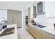 Modern kitchen with stainless steel appliances and light wood cabinets at 301 1St S St # 2905, St Petersburg, FL 33701