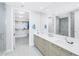 Modern bathroom with double vanity, walk-in shower, and large closet at 301 1St S St # 2905, St Petersburg, FL 33701