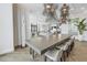 Long communal table and chairs in a modern community room at 301 1St S St # 2905, St Petersburg, FL 33701