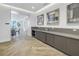 Modern kitchenette with stainless steel appliances and gray cabinetry at 301 1St S St # 2905, St Petersburg, FL 33701