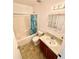 Bathroom with shower/tub combo, vanity and mirror at 5816 Congress St # 104, New Port Richey, FL 34653
