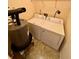 Laundry room with washer, dryer, and hot water heater at 5816 Congress St # 104, New Port Richey, FL 34653