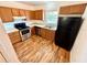Kitchen with stainless steel appliances and wood cabinets at 5816 Congress St # 104, New Port Richey, FL 34653
