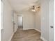 Bright bedroom features wood-look floors and neutral walls with natural light and ceiling fan at 49 W Boyer St, Tarpon Springs, FL 34689