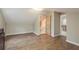 Spacious bedroom with wood-look floors features natural light and access to an en suite bathroom at 49 W Boyer St, Tarpon Springs, FL 34689