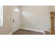 Bright entryway with a white front door, wood-look flooring, and neutral paint at 49 W Boyer St, Tarpon Springs, FL 34689