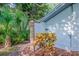 Small storage shed with white door and brick column detail at 1550 Chestnut W Ct, Palm Harbor, FL 34683