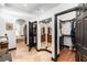 A large bathroom with multiple closets, and sinks, dark wood accents, and tiled flooring at 1570 Preserve Way, Clearwater, FL 33764