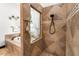Beautifully tiled bathroom featuring a soaking tub, window and separate shower with mosaic tile accents at 1570 Preserve Way, Clearwater, FL 33764