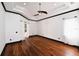 A spacious, empty bedroom with dark trim, tray ceiling, and access to the pool area at 1570 Preserve Way, Clearwater, FL 33764