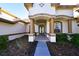 Inviting home entrance featuring stone accents, manicured landscaping, and a covered porch at 1570 Preserve Way, Clearwater, FL 33764