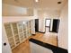 Bright hallway featuring built-in shelving with tiled floor and black door frames at 1570 Preserve Way, Clearwater, FL 33764