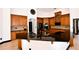 Kitchen boasting dark countertops, custom wood cabinets, stainless steel appliances, and ample counter space at 1570 Preserve Way, Clearwater, FL 33764