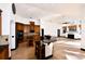 Open kitchen has granite countertops, an island with seating, and hardwood flooring at 1570 Preserve Way, Clearwater, FL 33764