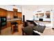 Open kitchen with an island, granite countertops, and a seamless view into the living area at 1570 Preserve Way, Clearwater, FL 33764